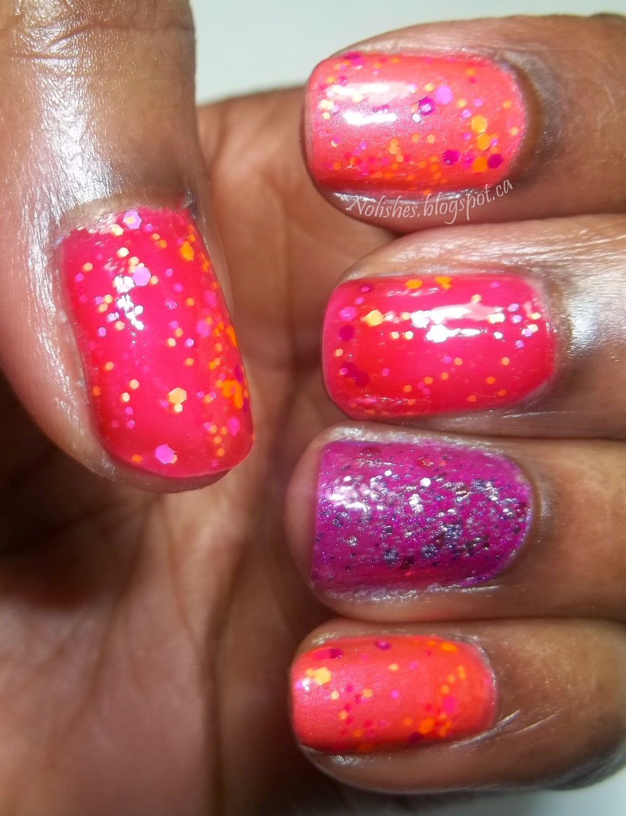 Skittles manicure with purple, fuchsia, and coral polishes covered in a purple, fuchsia,and orange glitter. Accent nail is covered with a traditional metallic glitter with lilac, pink, and plum tones.