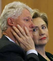 Bill and Hillary Clinton sitting in court