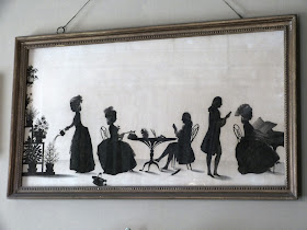 A silhouette ink drawing of the Parminter family in 1783 by François Torond above the mantelpiece in the Drawing Room, A la Ronde