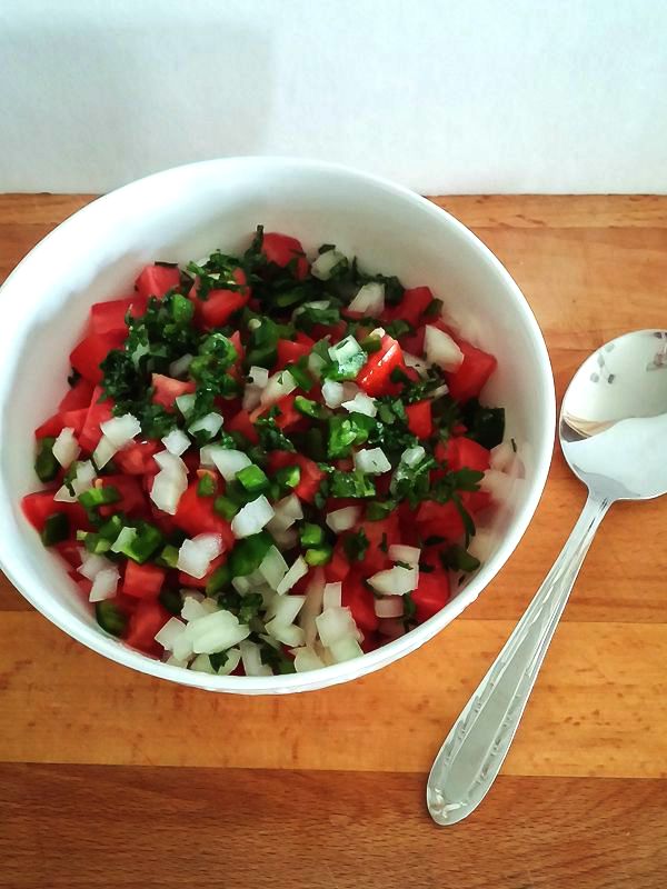 Easy and fresh Pico de Gallo is amazing with tortilla chips or as a garnish! Get the recipe at DIY beautify!