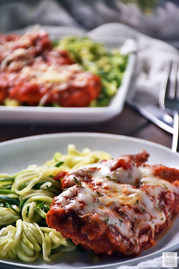 Keto Chicken Parm with a side of zoodles on a white plate