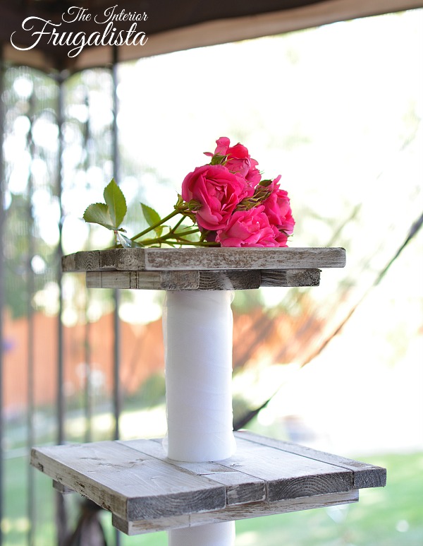 A portable DIY four-tiered rustic country wedding cupcake stand with small top tier for cake topper, easily assembled on site for destination wedding.