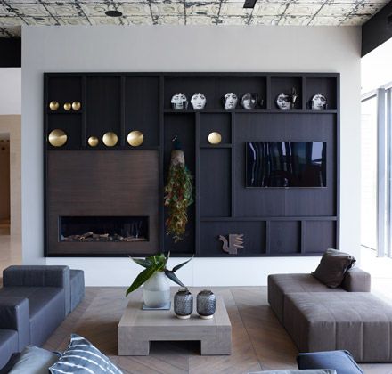 Modern luxury media wall fireplace minimal sophisticated interior design by Piet Boon 