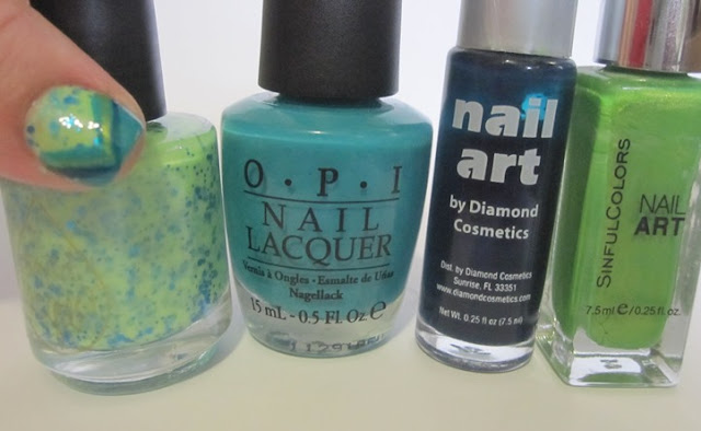 Bottle shot:  Liquid Lacquer Blue Pistachio, OPI Fly, and stripers in navy blue and electric green.