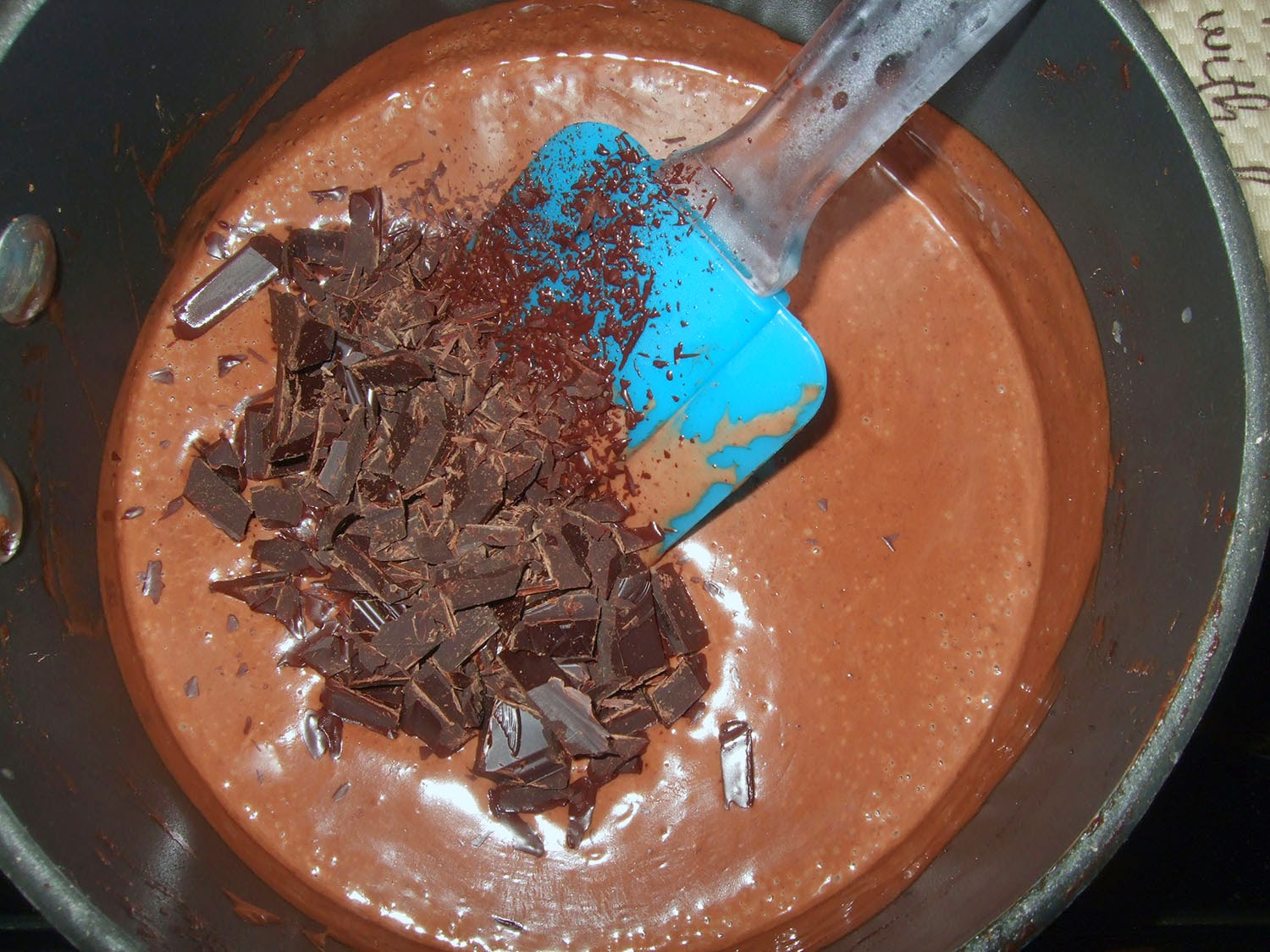 Add chopped chocolate to cream/cocoa mixture.