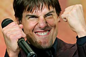 Tom Cruise smirking and laughing