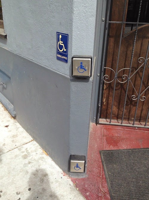 Business entrance has two accessible buttons to auto-open the door, depending on if you’re standing or sitting, wheelchair user, walker or came user, prefer to use your hands or kick the button