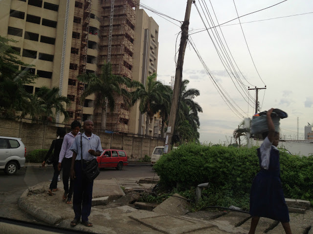 Nigerians walking down street in Lagos