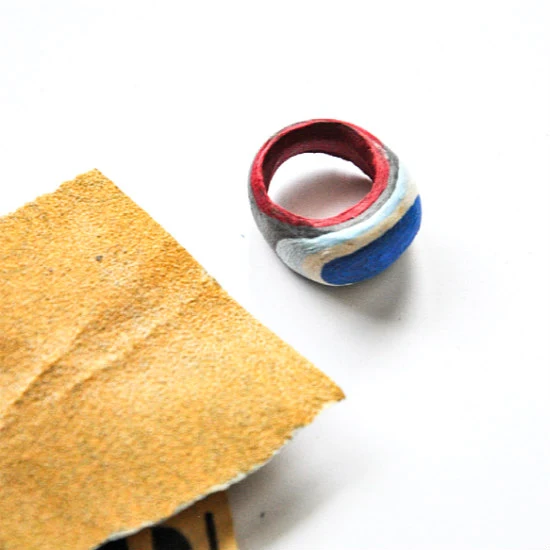 sandpaper with layered paper ring in progress
