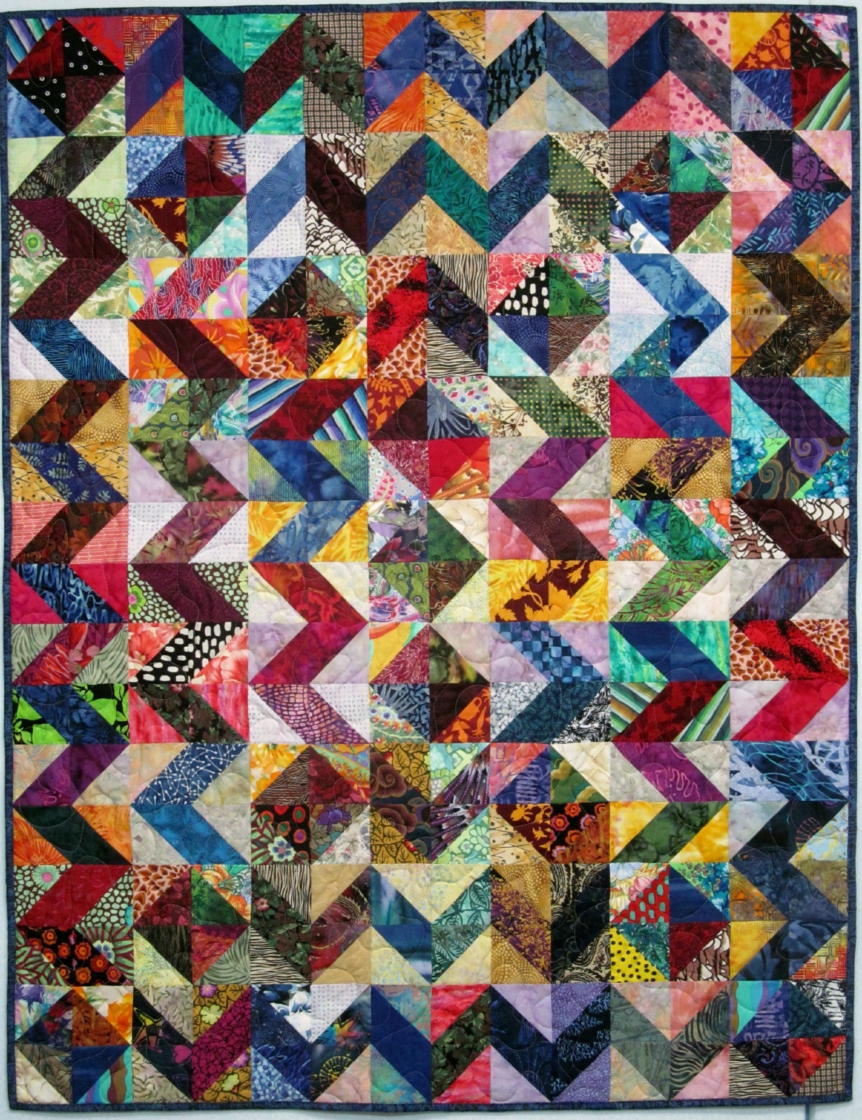 Exuberant Color Quilts made with triangles