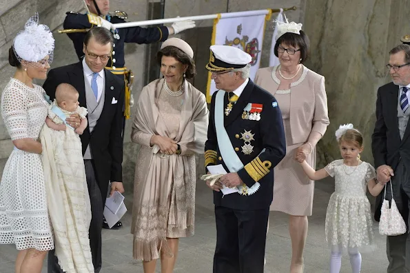 Queen Silvia and King Carl Gustaf of Sweden, Crown Princess Victoria, Prince Daniel, Princess Estelle, Princess Madeleine of Sweden with daughter Princess Leonore and Christopher O'Neill, Prince Carl Philip and Princess Sofia, Prince Haakon and Princess Mette-Marit of Norway, Crown princess Mary and Prince Frederik of Denmark, Ewa and Olle Westling at the christening of Prince Oscar of Sweden at the Royal Chapel in Stockholm.Antonio Berardi Blue Cape-back Stretch Crepe Dress