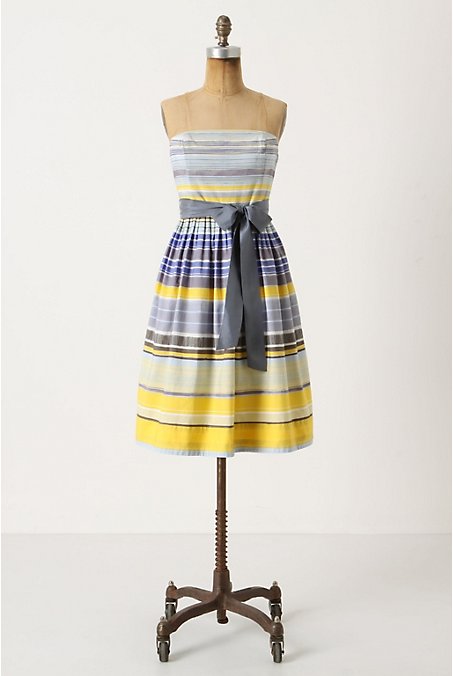 Strapless summer dress by Anthropologie with blue, yellow, grey and black stripes and a belted waist