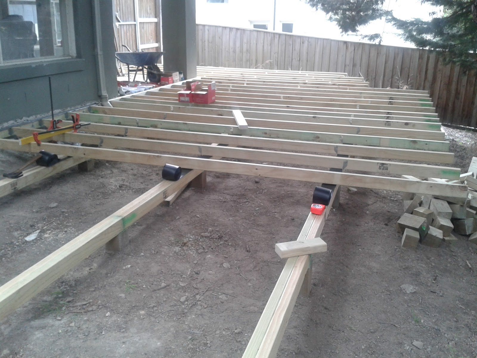 Let's Build a Deck Deck building. Laying in the ledger and joists