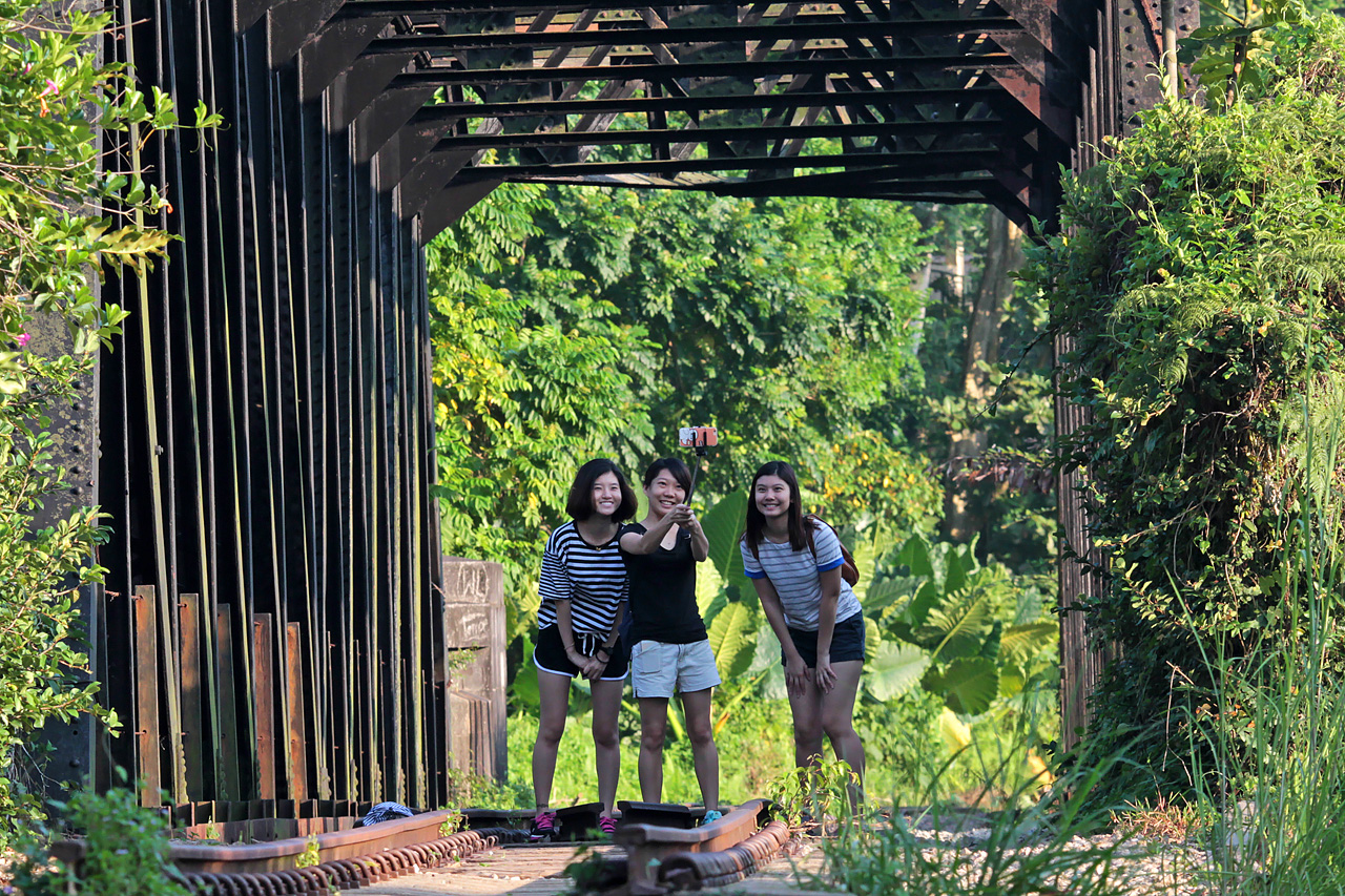 The black railway truss bridge