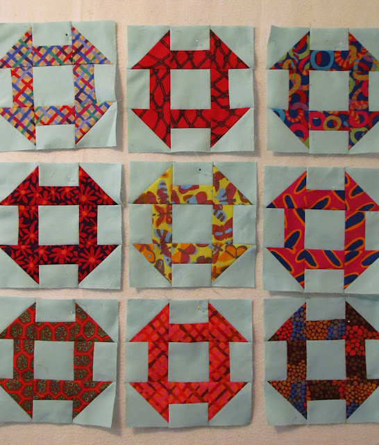two-fabric churn dash blocks using Brandon Mably, Kaffe Fassett and Kona aqua