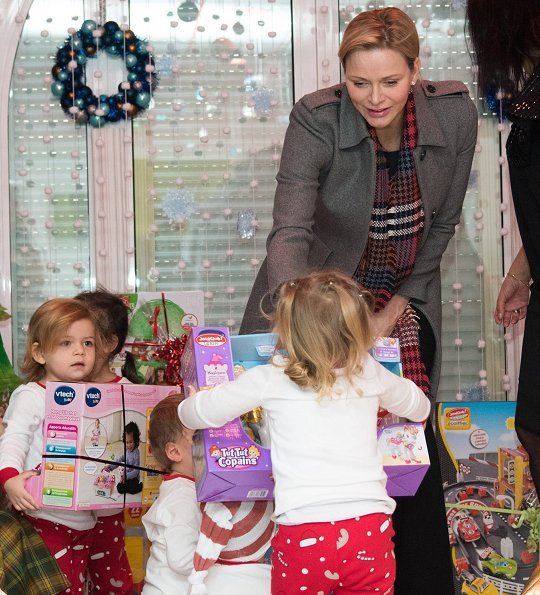 Princess Charlene wore Louis Vuitton wool coat. Rosine Sanmori Nursery / Day Care Centre in Fontvieille. Christmas gifts