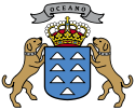 Kanarian vaakuna: kilpi, kruuna ja kaksi koiraa. Teksti: Oceania.