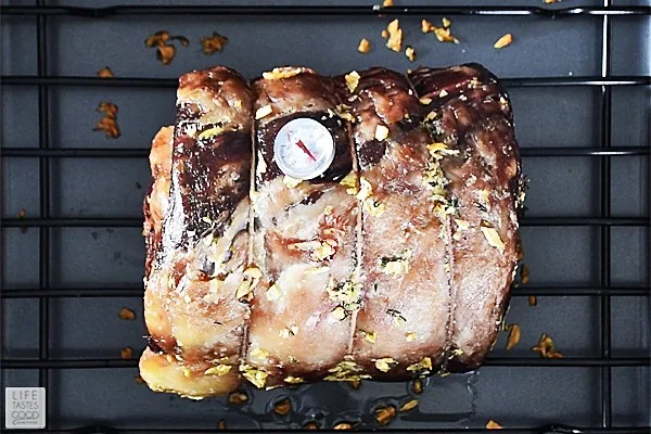 Using an instant read thermometer to check the temperature of our slow roasted boneless prime rib roast