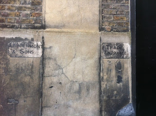 Ghost sign, in a mews entrance near Paddington, London