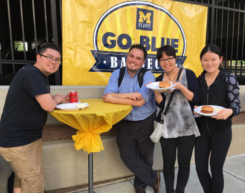 International students at Go Blue Barbecue University of Michigan, Flint!