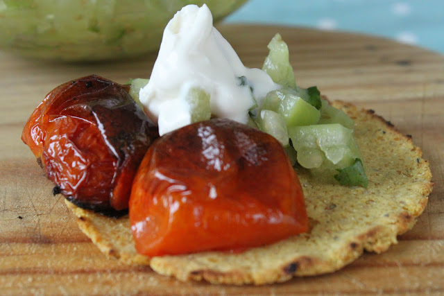 Fresh corn taco with grilled tomatoes and tomatillo salsa