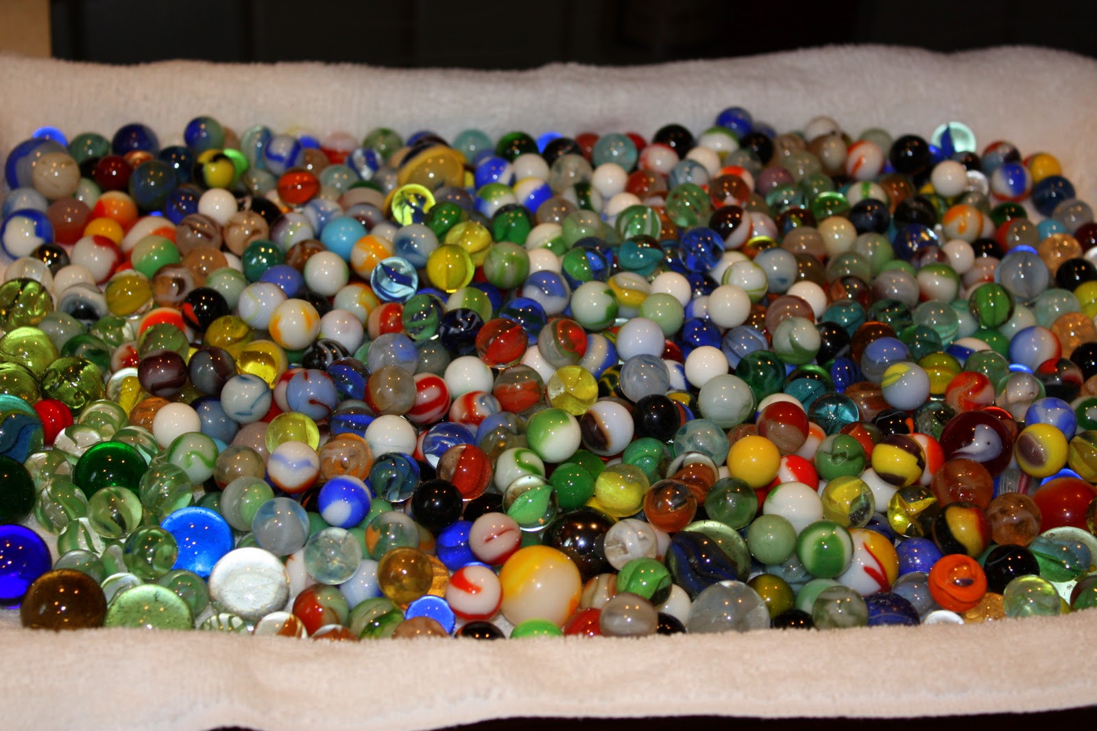 sprinkled blessings studios Vintage marbles, discarded Patron bottles