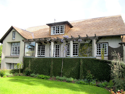 Front of an old arts-and-crafts-style building.