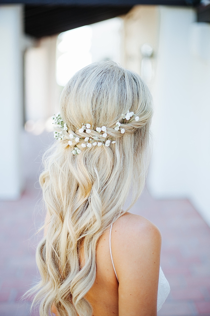 Long Wavy Bridal Hairstyle with flowers | Photography: Photography by Ben and Kadin | Wedding Planner: Jessica Lauren Events