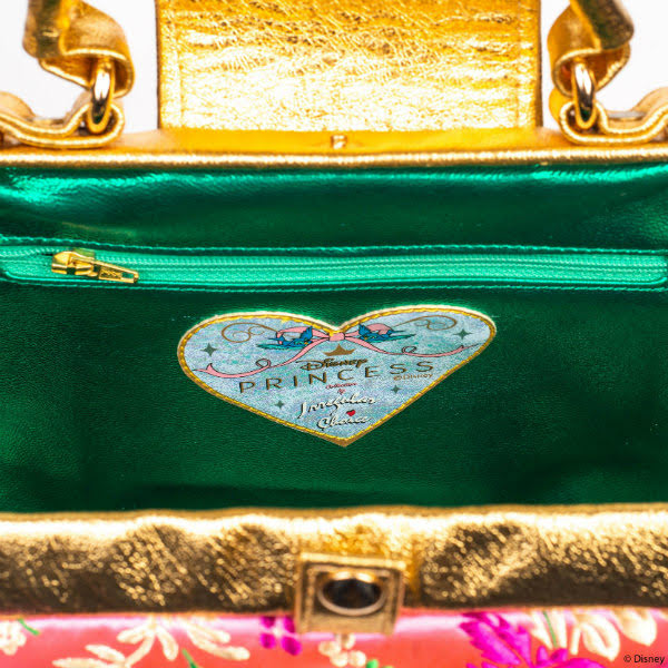 Irregular Choice Teaser Mulan handbag inside of handbag with green metallic lining and gold studs