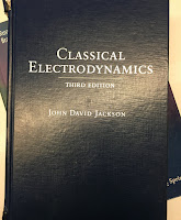 Classical Electrodynamics, 3rd Ed, by John David Jackson, superimposed on Intermediate Physics for Medicine and Biology.