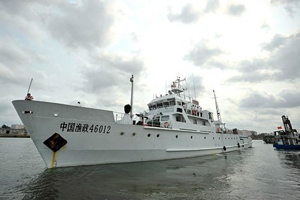 U.S. Coast Guard still protects Vietnamese fishermen from Chinese ships such as this one leaving the Xingang Port of Haikou on March 26.