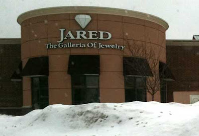 Photo of the entrance of Jared The Galleria of Jewelry, with a white diamond logo above the name