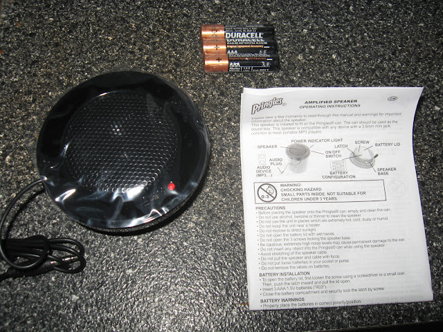 The speaker gadget, 3 AAA batteries, and the instructions