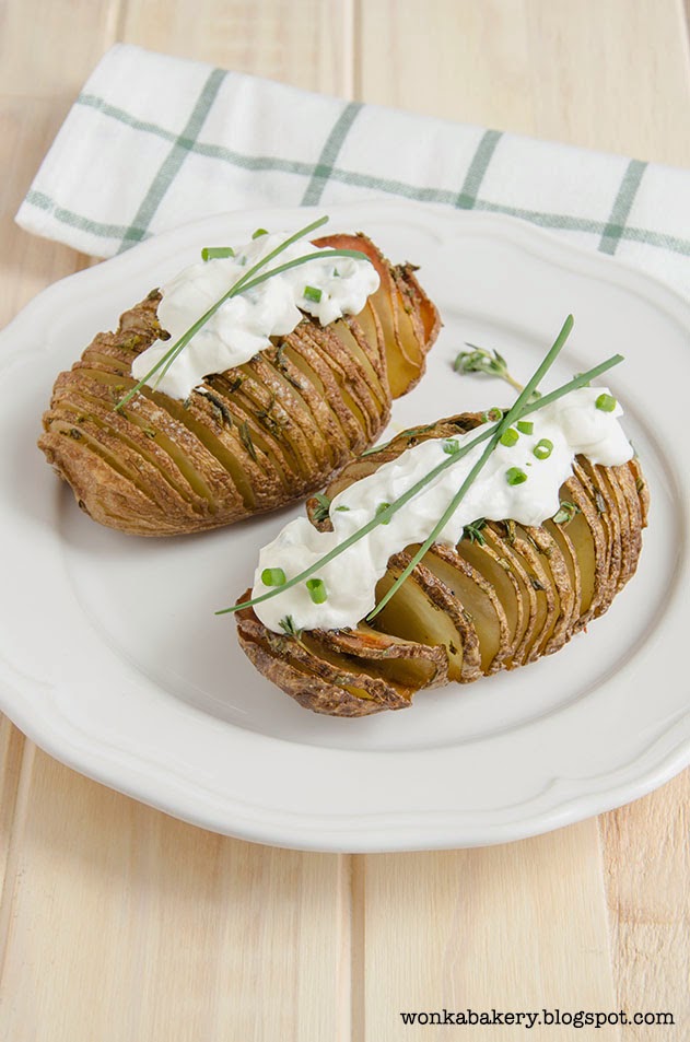 hasselback potatoes and sour cream with chive.