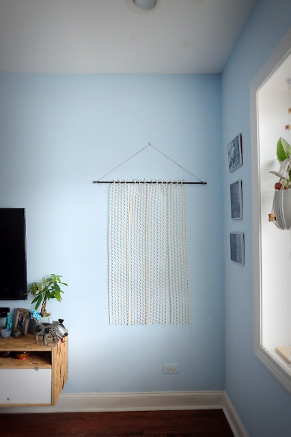 finished fiber art wall hanging DIY with wool felt and rebar