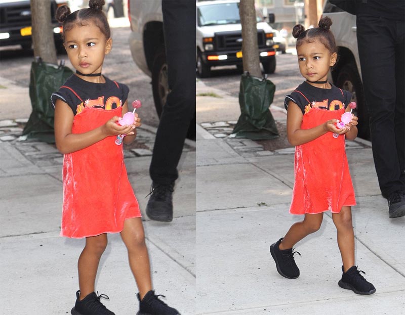Adorable baby North West and her lollipop during family outing... Adorable baby North West and her lollipop during family outing...