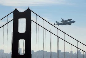 Space shuttle over a sunny San Francisco