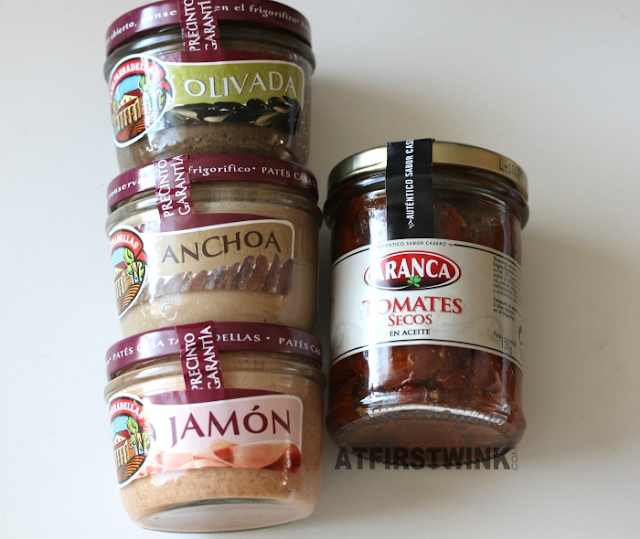 Barcelona souvenirs: casa taradellas glass jars pate olives, anchovis, and jamon ham & aranca dried tomatoes