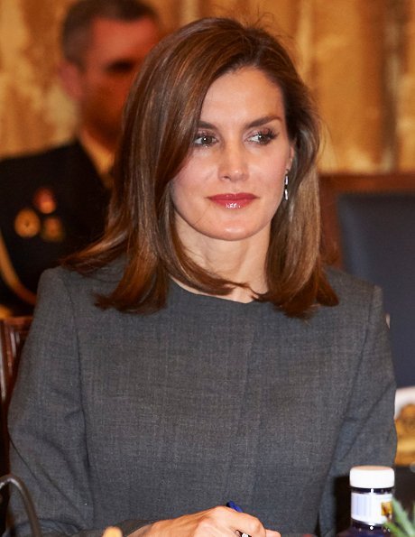 Queen Letizia carries Madmacarena python snake clutch bag. Uterque shoes, diamond jewellery earring