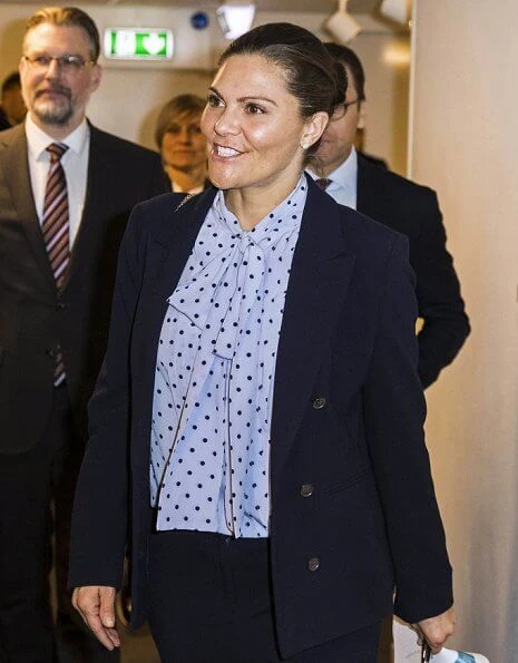 Crown Princess Victoria is wearing Af Klingberg rakel suede nero boots,  she carres Valentino shoulder bag, polka dot blue silk blouse