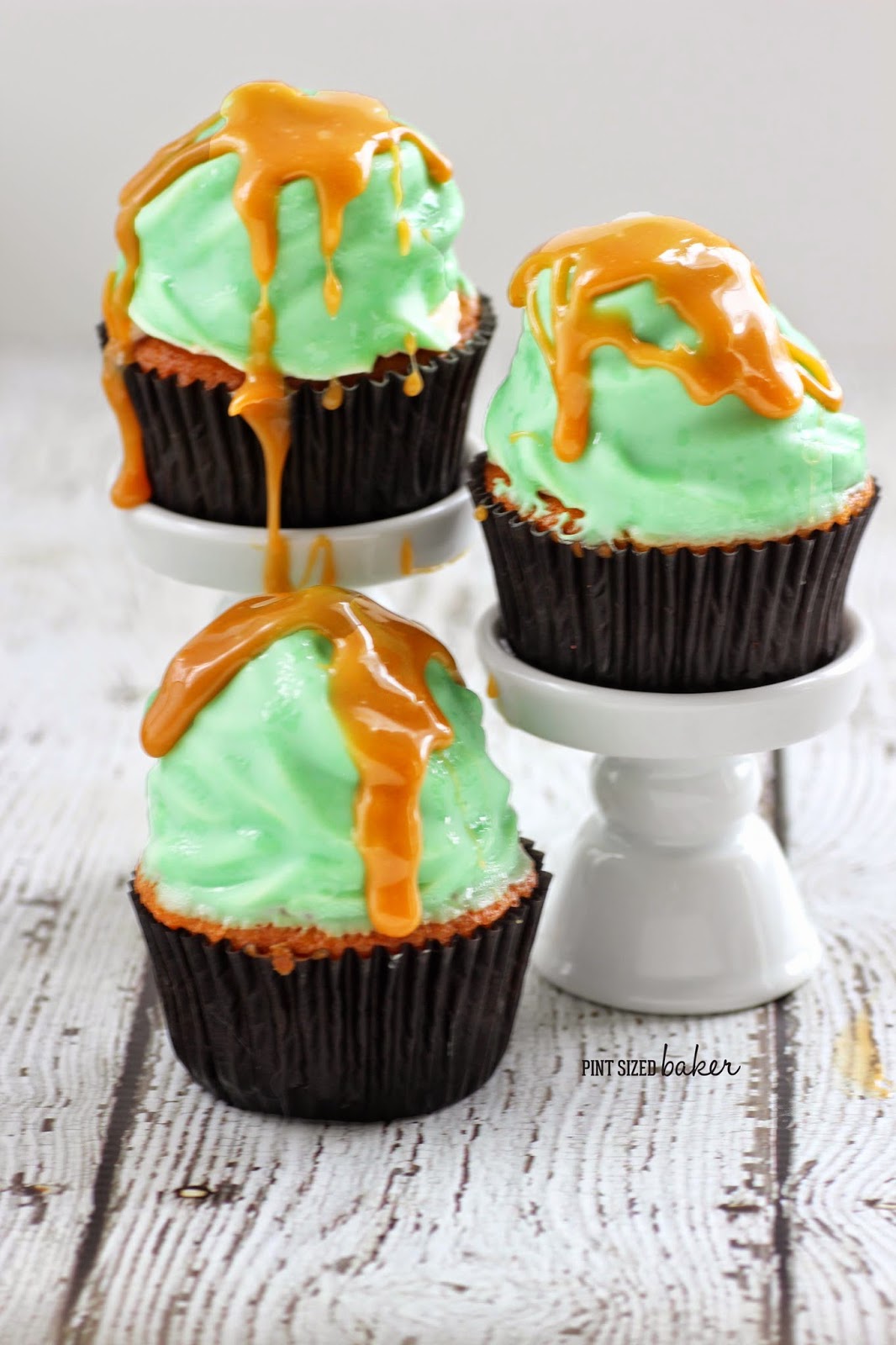 Green Apple High Hat Cupcakes drizzled with caramel sauce are easier to eat than a real caramel apple.