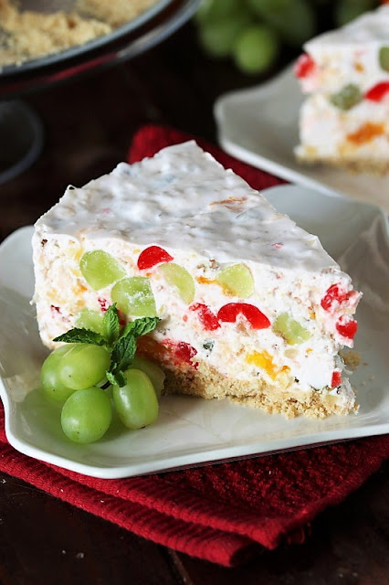 25+ All-Time Favorite No-Bake Desserts: Fruit Salad Cheesecake Image