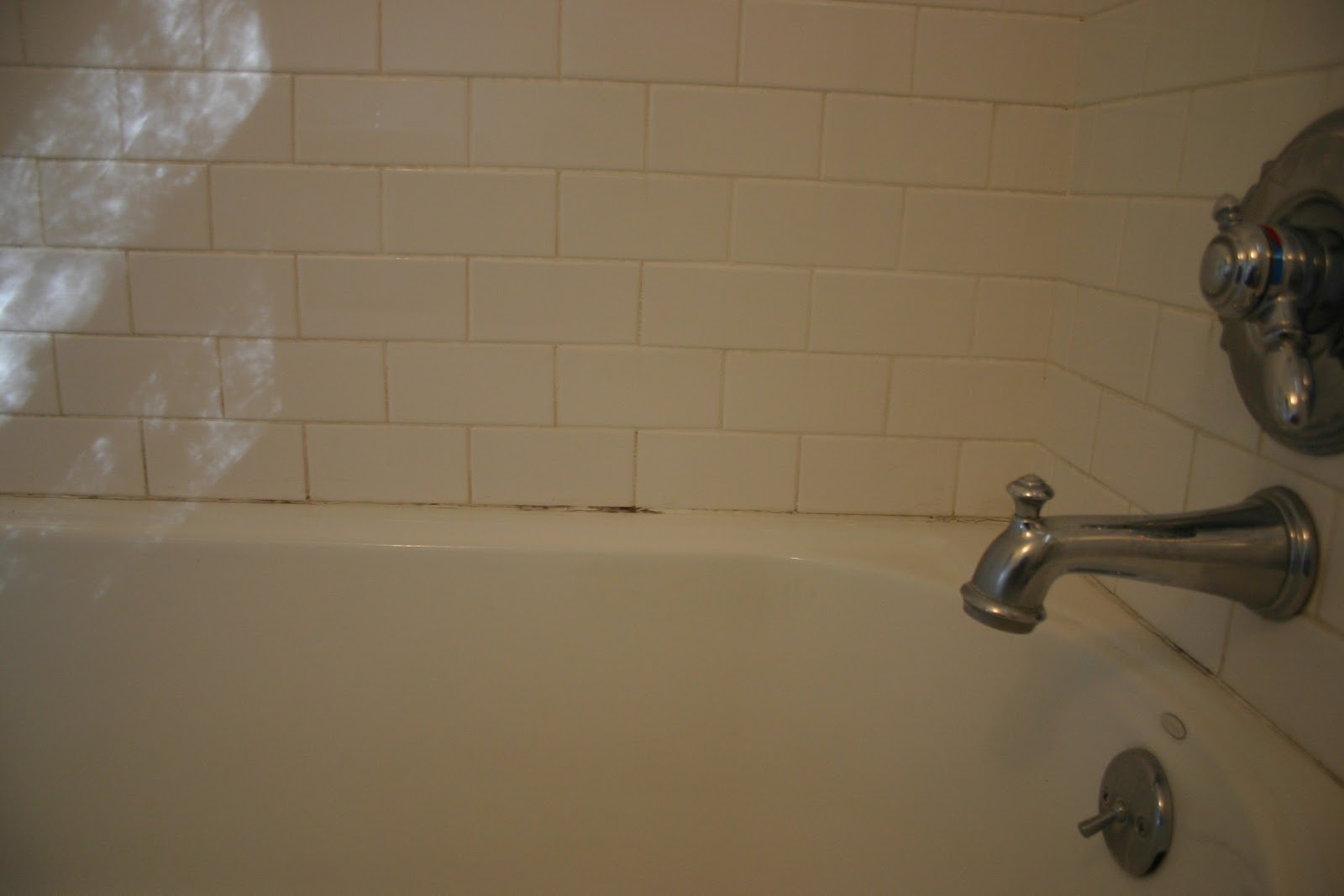 re caulking the bathtub The Gardener's Cottage