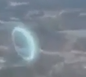 Stargate dimensional portal filmed from the window of a plane.
