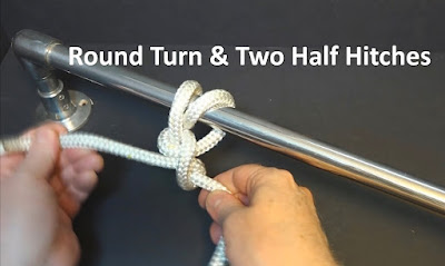 Belaying a round turn and two half hitches to a rail