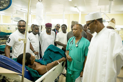Photos: Pres. Buhari visits Abuja bomb blast victims, pays bill of girl shot by armed robbers