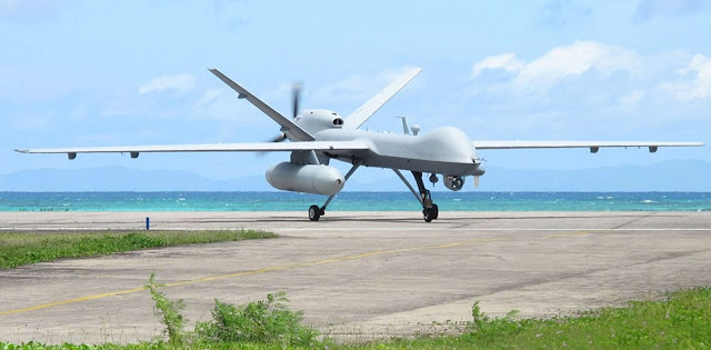 A MQ-9 Reaper with external fuel tank is seen operating out of a forward base in the region