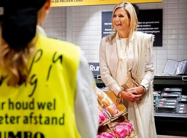 Queen Maxima wore Massimo Dutti ivory silk blouse with bow and trousers, Cartier Gold Bamboo earrings