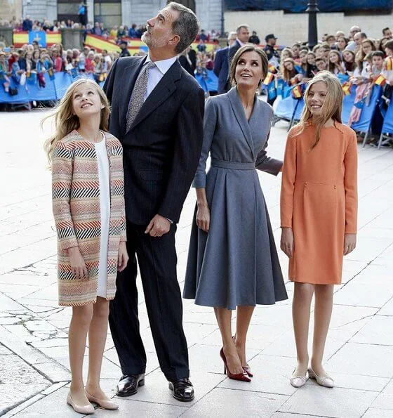 Queen Letizia wore grey coat dress, Crown Princess Leonor wore a Mango pattern jacket and Infanta Sofía wore a coral Mango dress