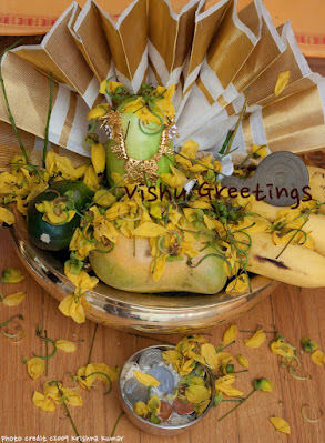 Kerala state flower: Kannikonna On a Vishu kanni (Vishu greetings for good luck), with the famous vallkannadi (special mirror) Kerala state flower: Kannikonna On a Vishu kanni (Vishu greetings for good luck), with the famous vallkannadi (special mirror)